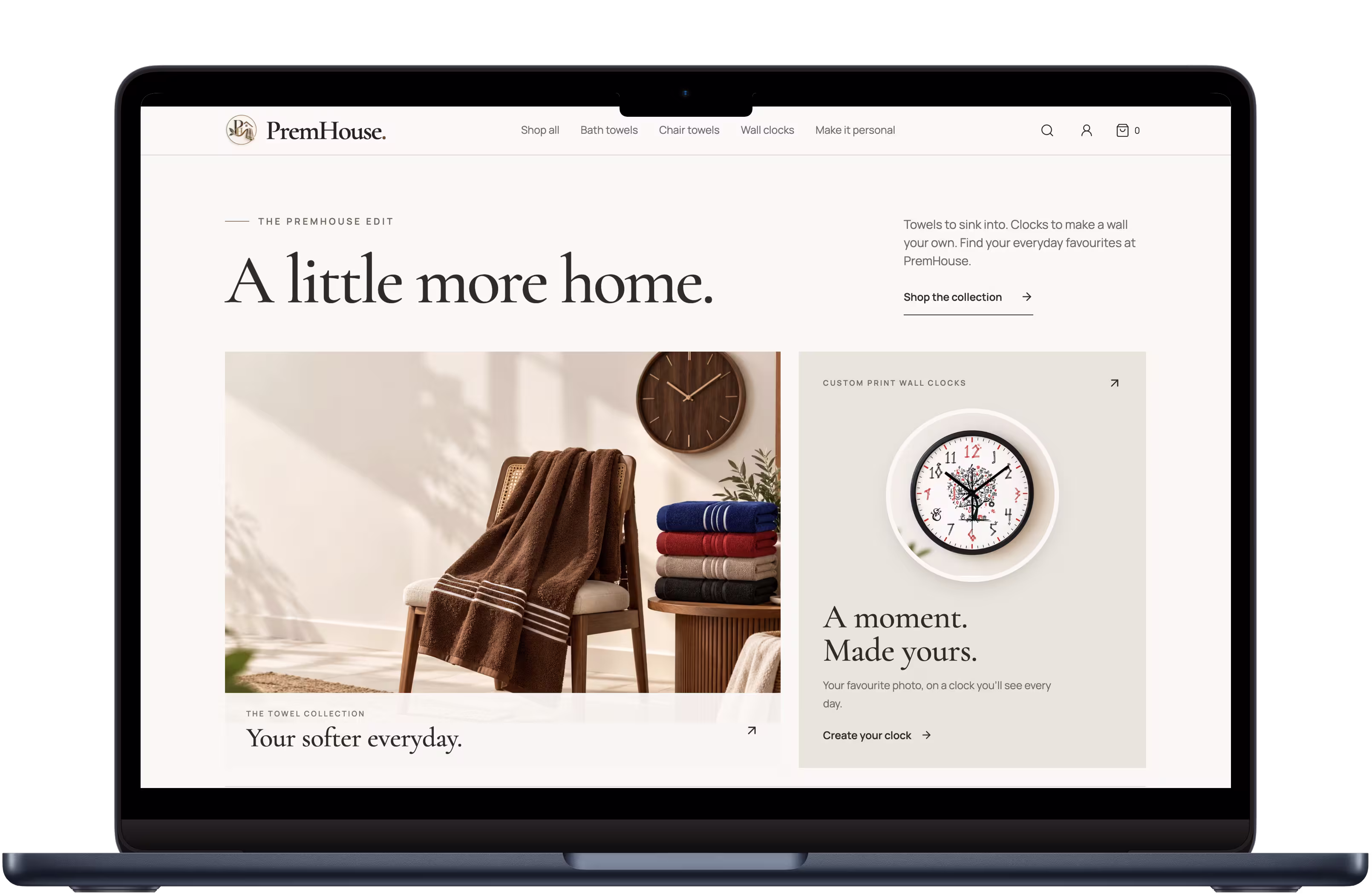 PremHouse ecommerce homepage displayed on a laptop, featuring towels and custom photo clocks